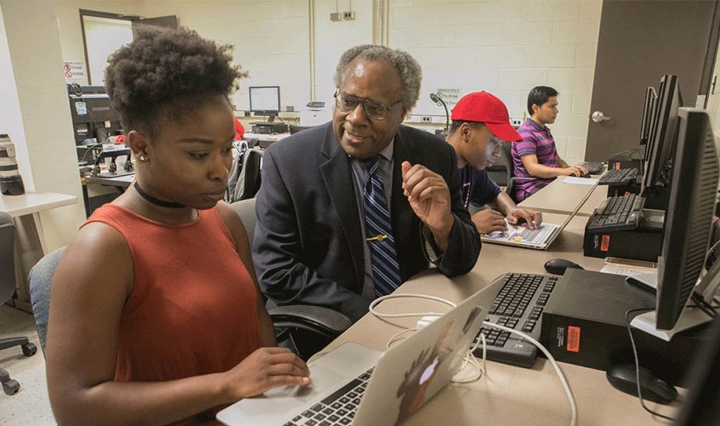 Dr. Ferguson advising student in computer lab